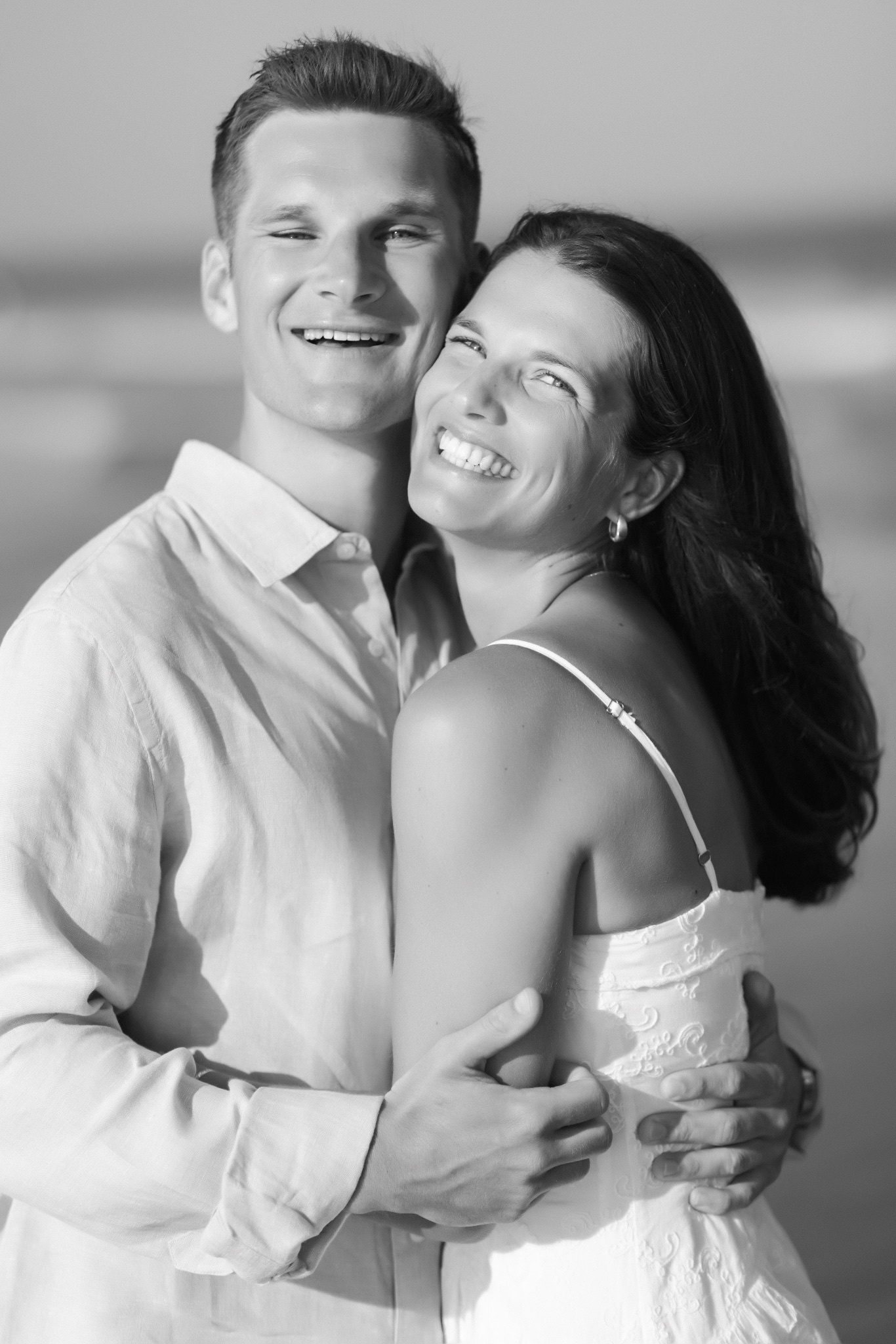 Black and white engagement portrait of Katie and Chris on the beach in Stone Harbor, New Jersey