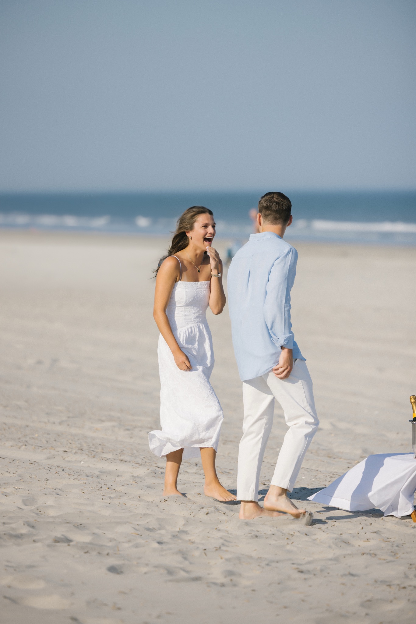Katie's surprised reaction as Chris begins his surprise proposal on the beach in Stone Harbor, New Jersey