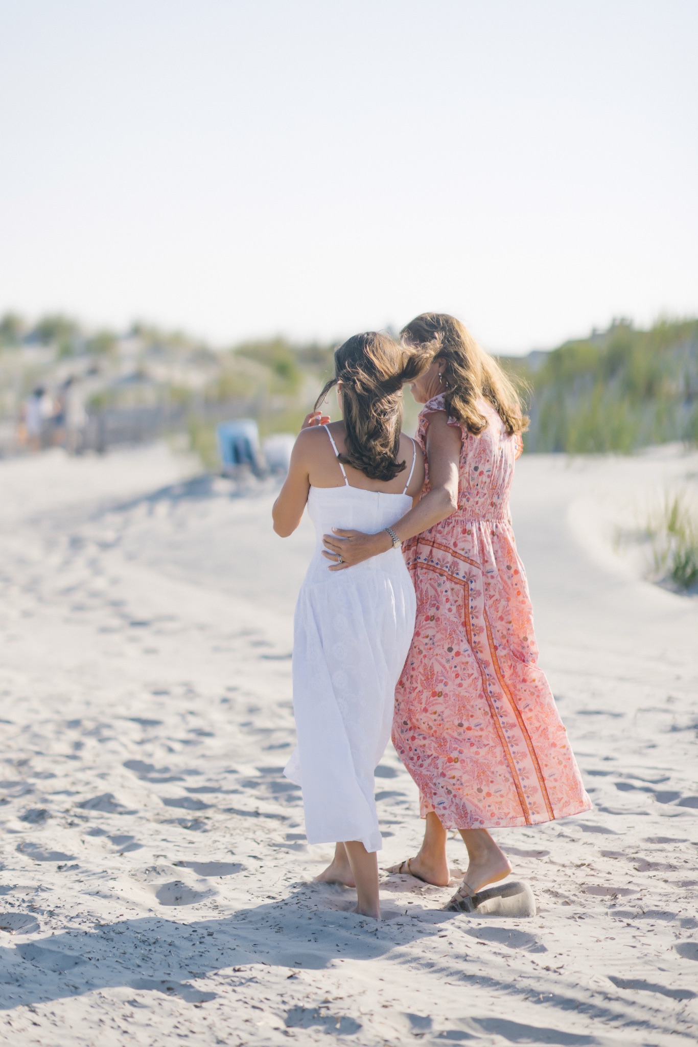 Katie hugging her mom on the beach after the surprise proposal in Stone Harbor, New Jersey