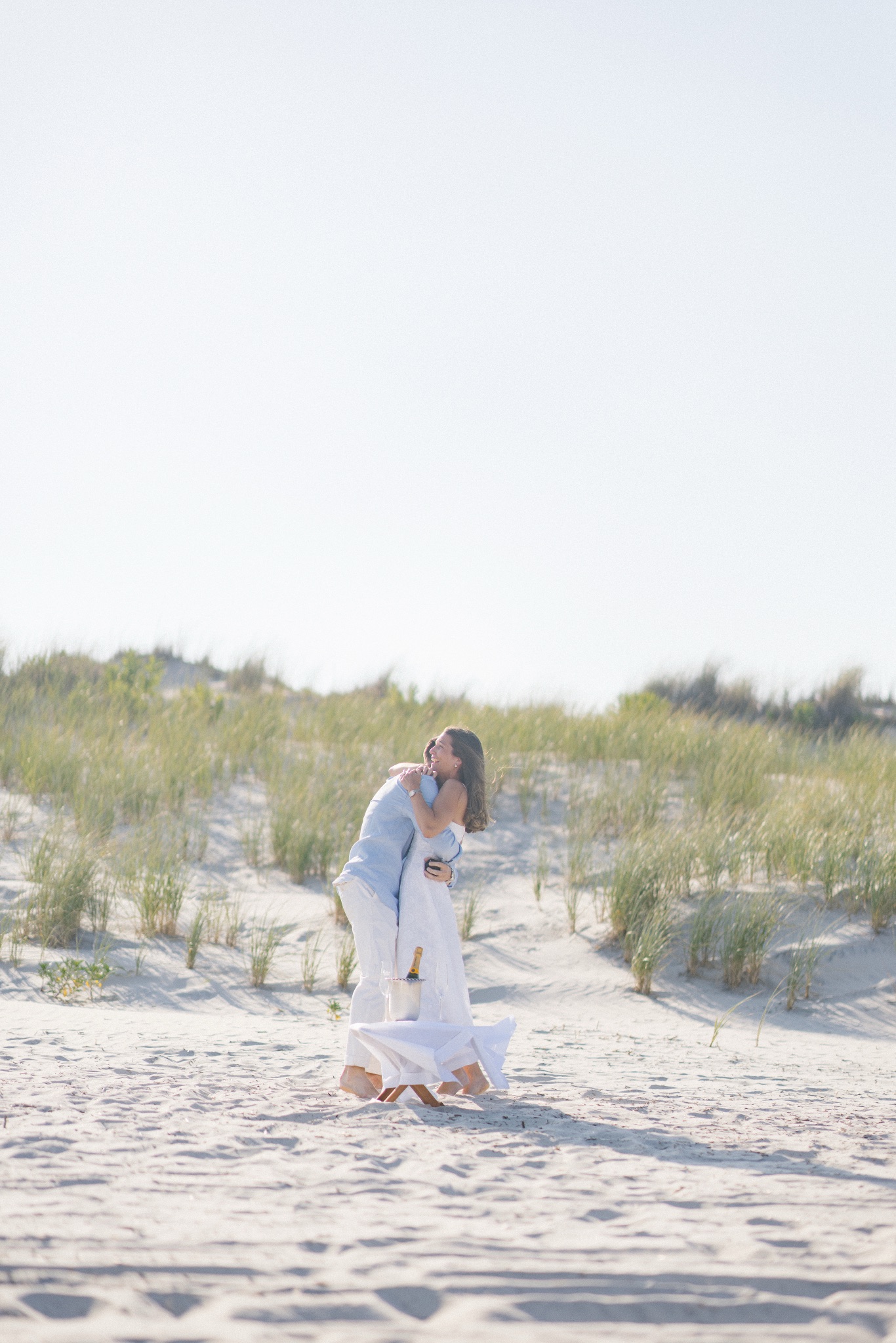Katie and Chris hugging right after she said yes on the beach in Stone Harbor, New Jersey