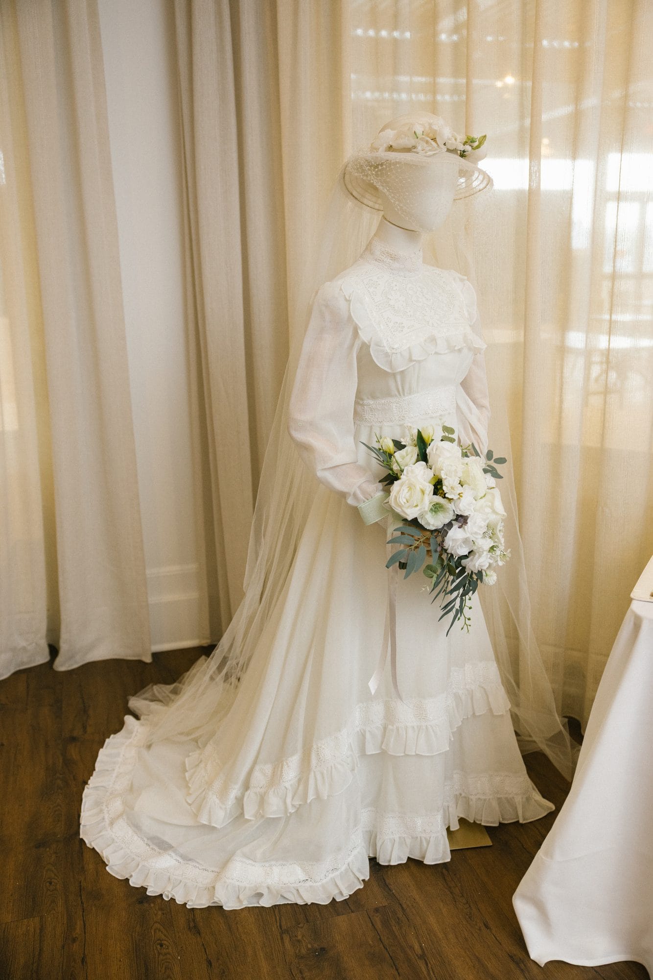 A lace wedding gown on display at Stu and Betsy's 50th wedding anniversary vow renewal in New Jersey