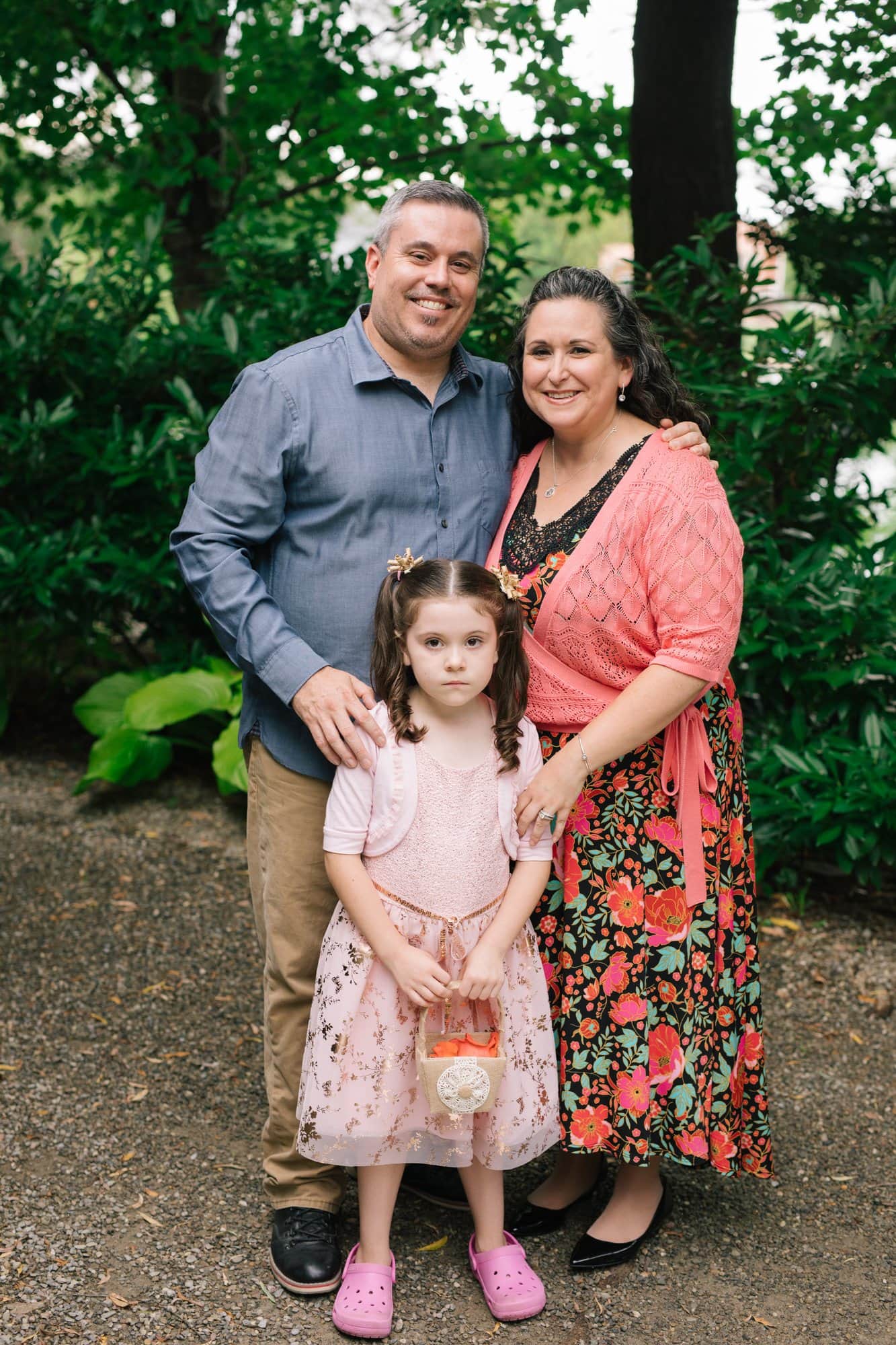 A couple with their daughter, son-in-law and granddaughter at a vow renewal at Grounds for Sculpture