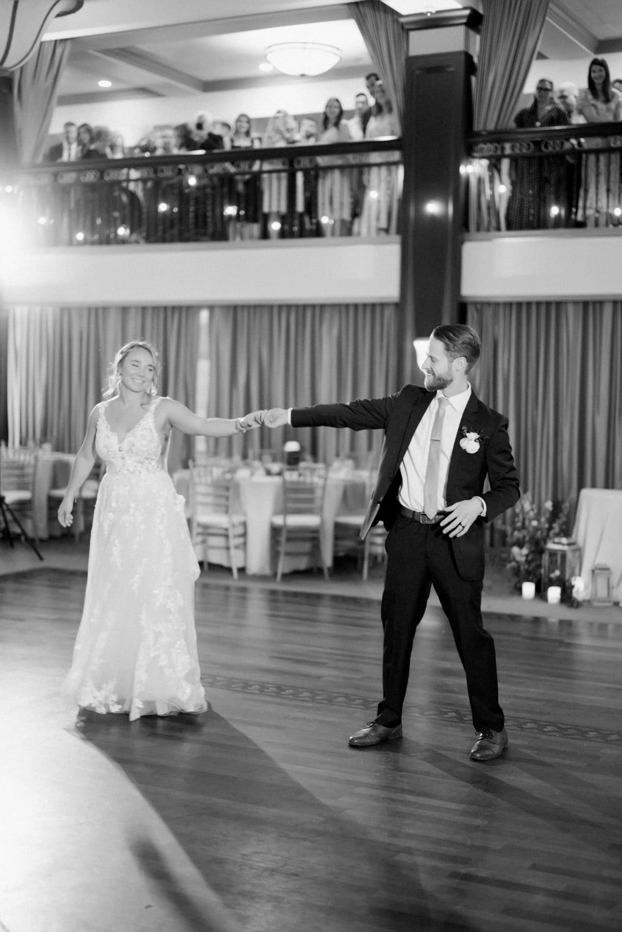 Spot lit first dance in the Collingswood Grand Ballroom after the second floor curtains open