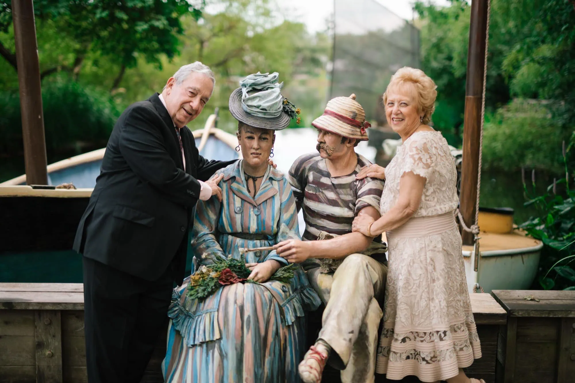 An older couple photographed beside a sculpture at Grounds for Sculpture in Hamilton, New Jersey