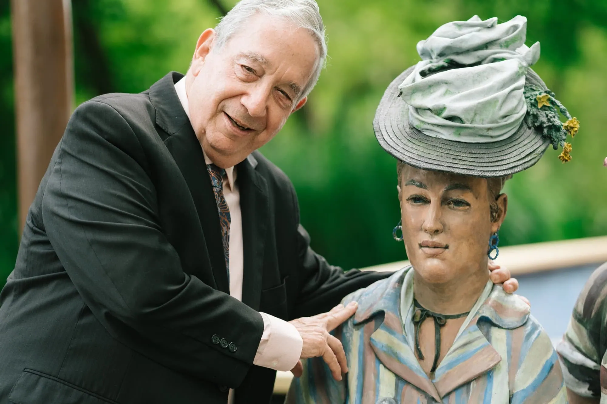 An older man laughing during a vow renewal portrait session at Grounds for Sculpture