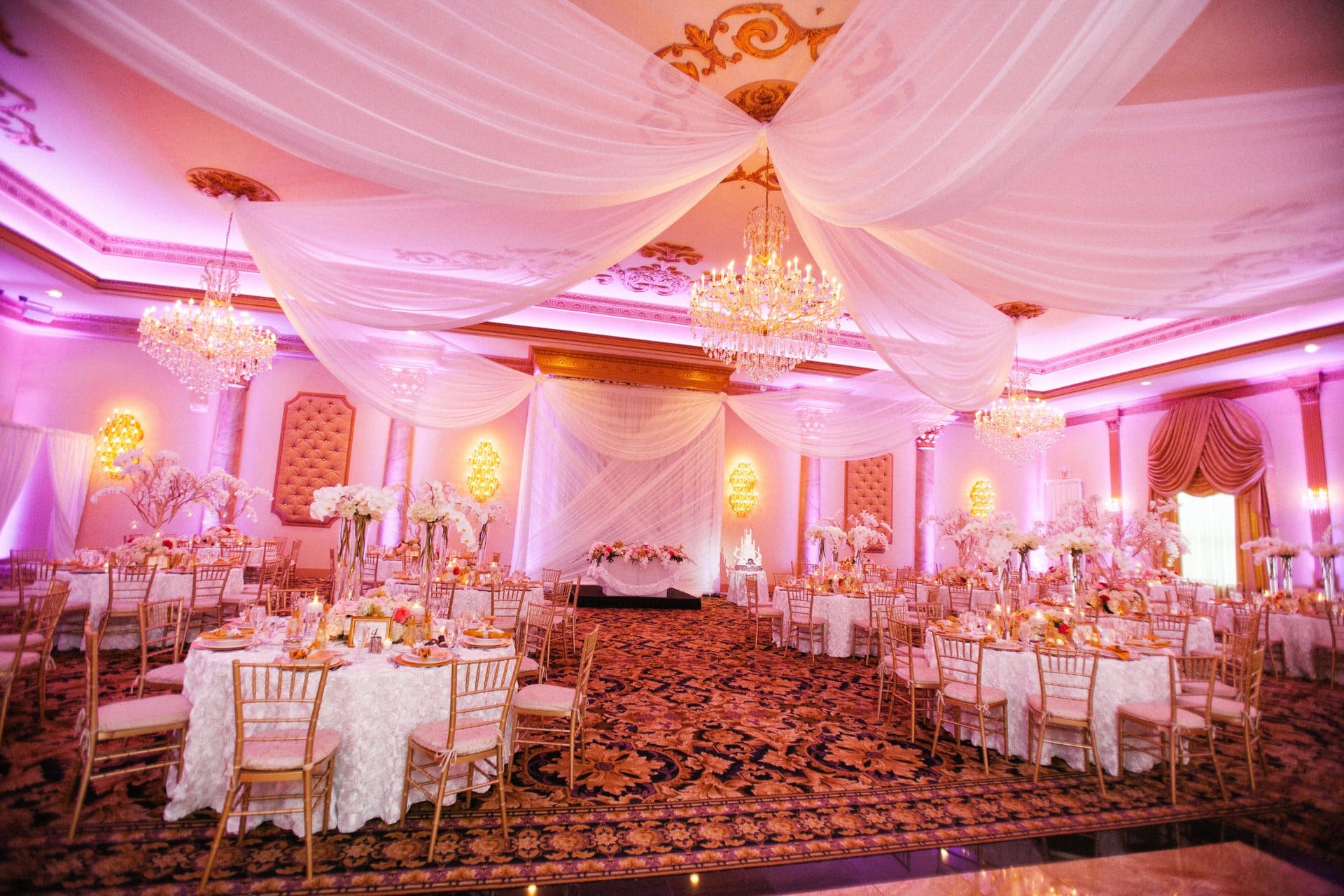 Lucien's Manor ballroom with the ceiling swagged in white fabric above the dance floor