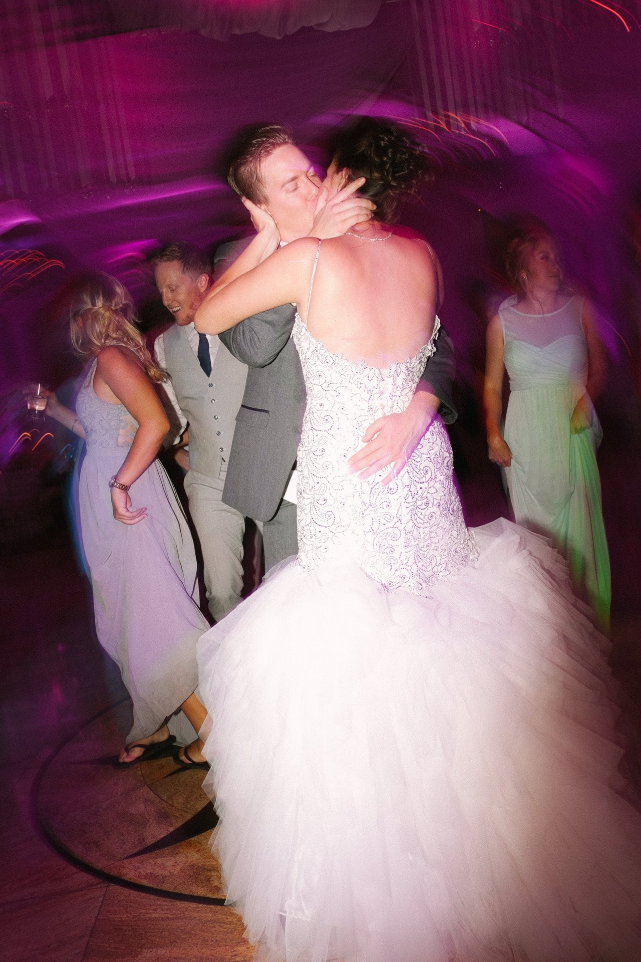 Bride and groom close together mid song