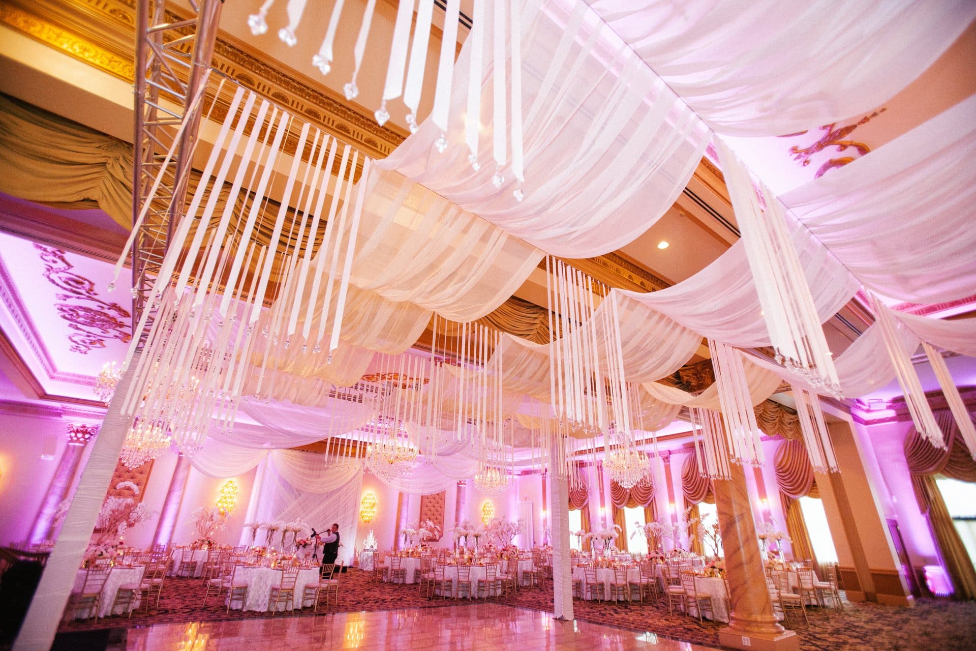 Crystal-tipped ribbons hanging from the rigged ballroom ceiling at Lucien's Manor