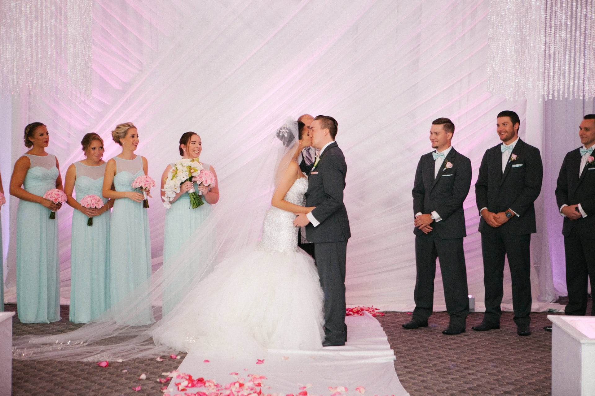 Bride and groom's first kiss at the altar