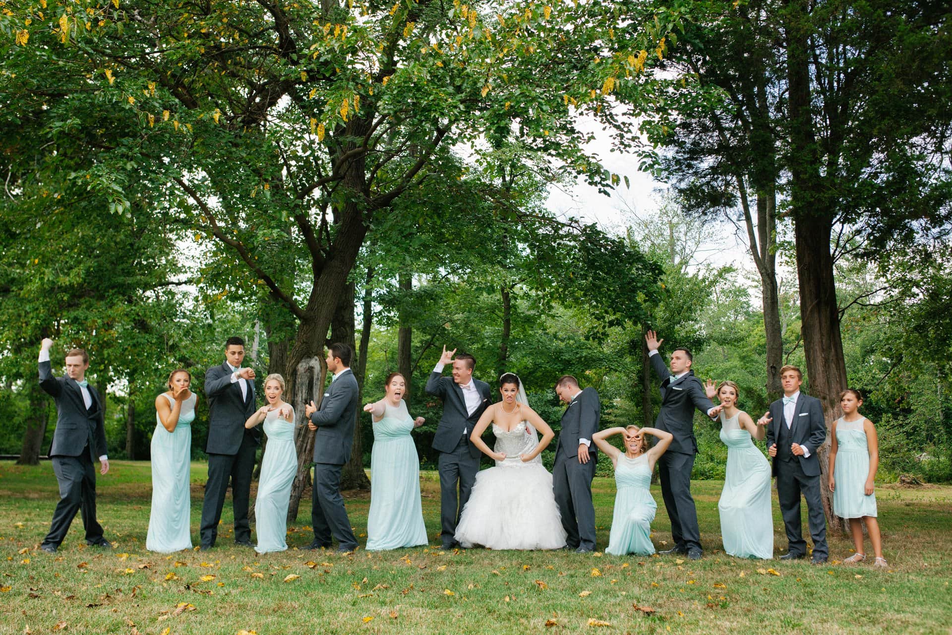 Wedding party goofing off between formal portraits at Berlin Park