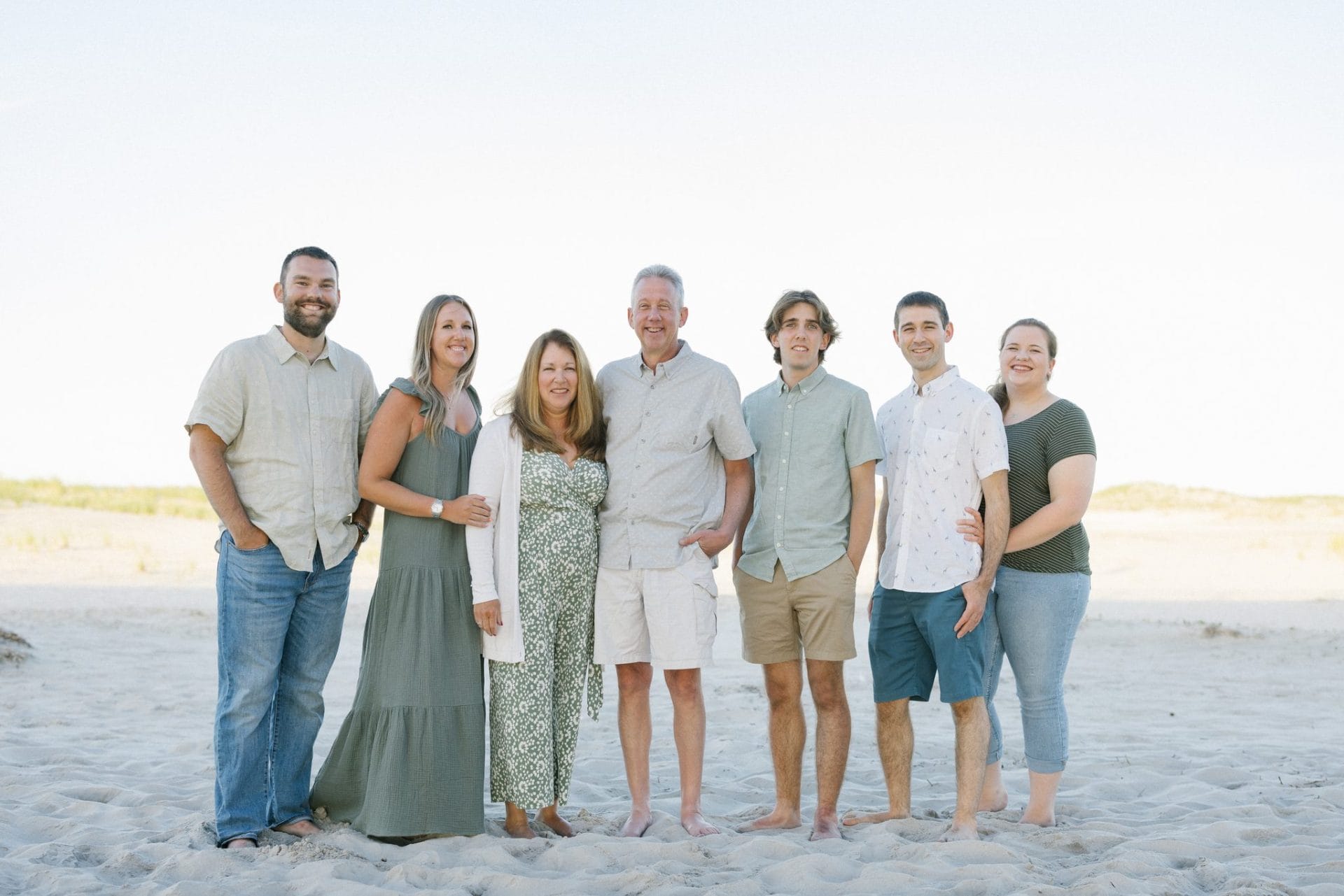 A family lined up together on the beach during an evening portrait session in Ocean City, New Jersey