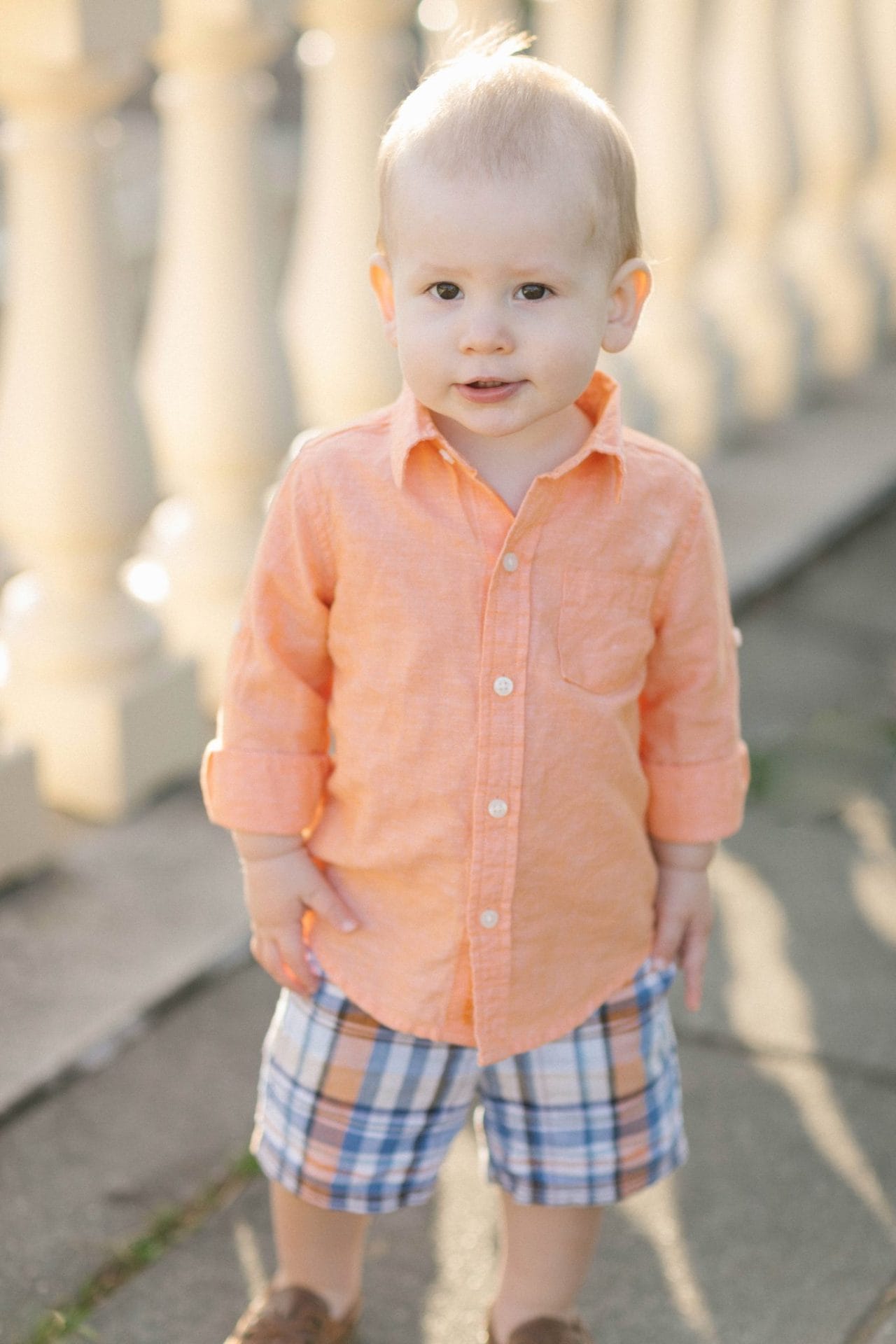 A close portrait of a small boy during a family session at the Fairmount Water Works in Philadelphia