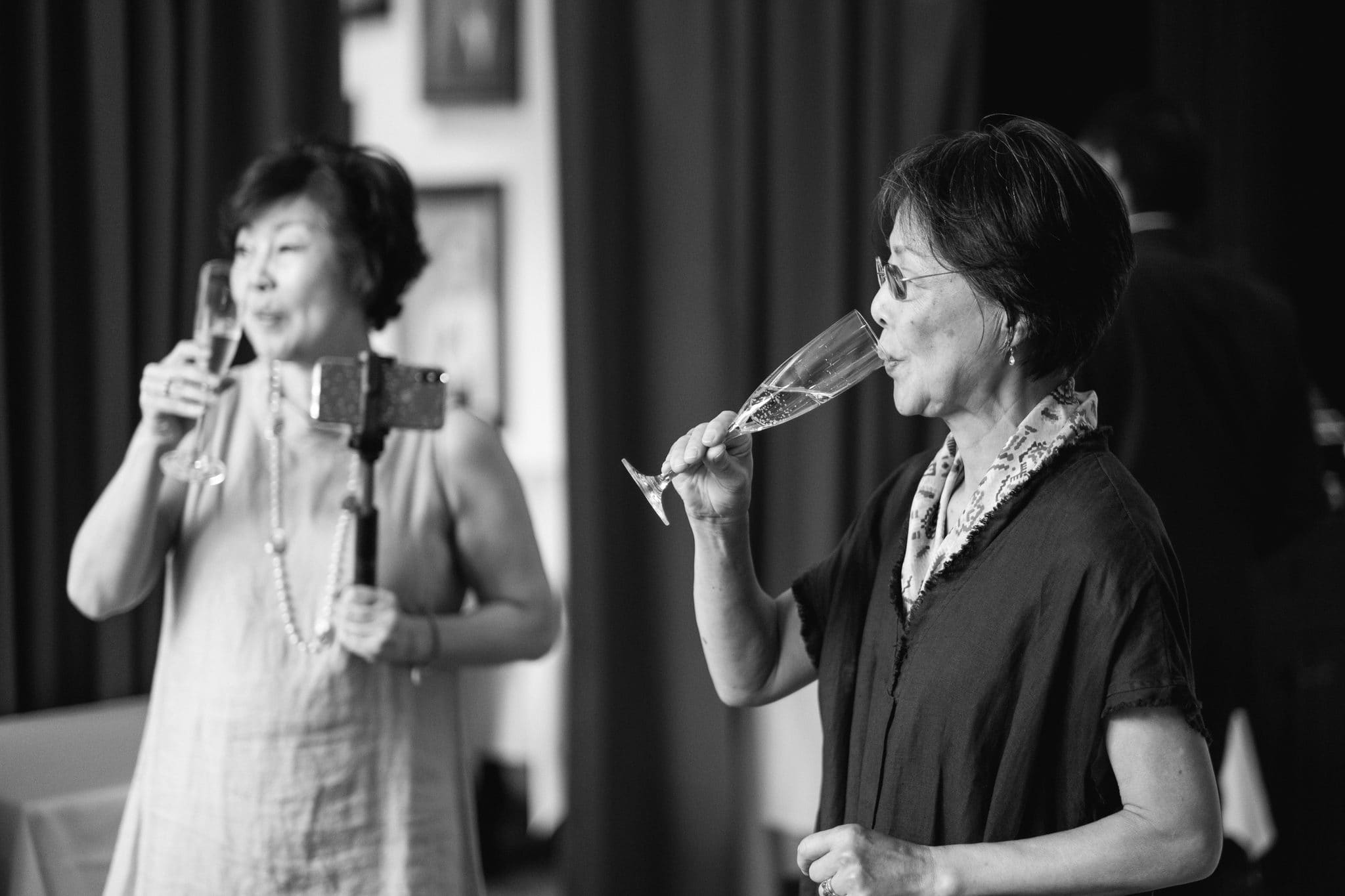 A candid moment over champagne during the cocktail hour at The Rittenhouse in Philadelphia