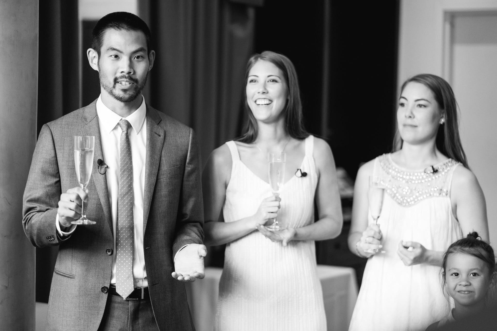 Family members with champagne during the indoor cocktail hour at The Rittenhouse in Philadelphia