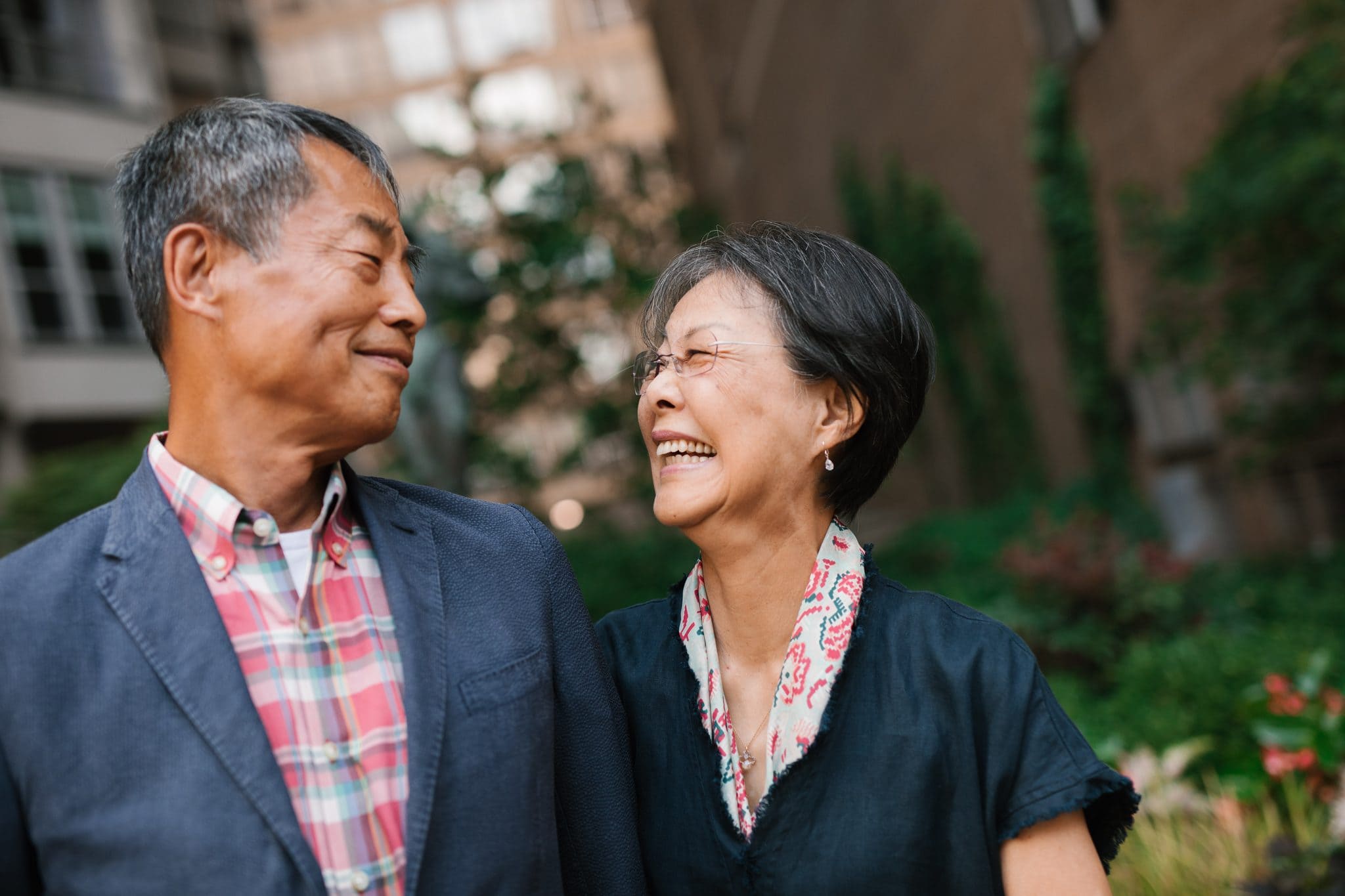 A couple laughing together during family reunion photographs in Philadelphia