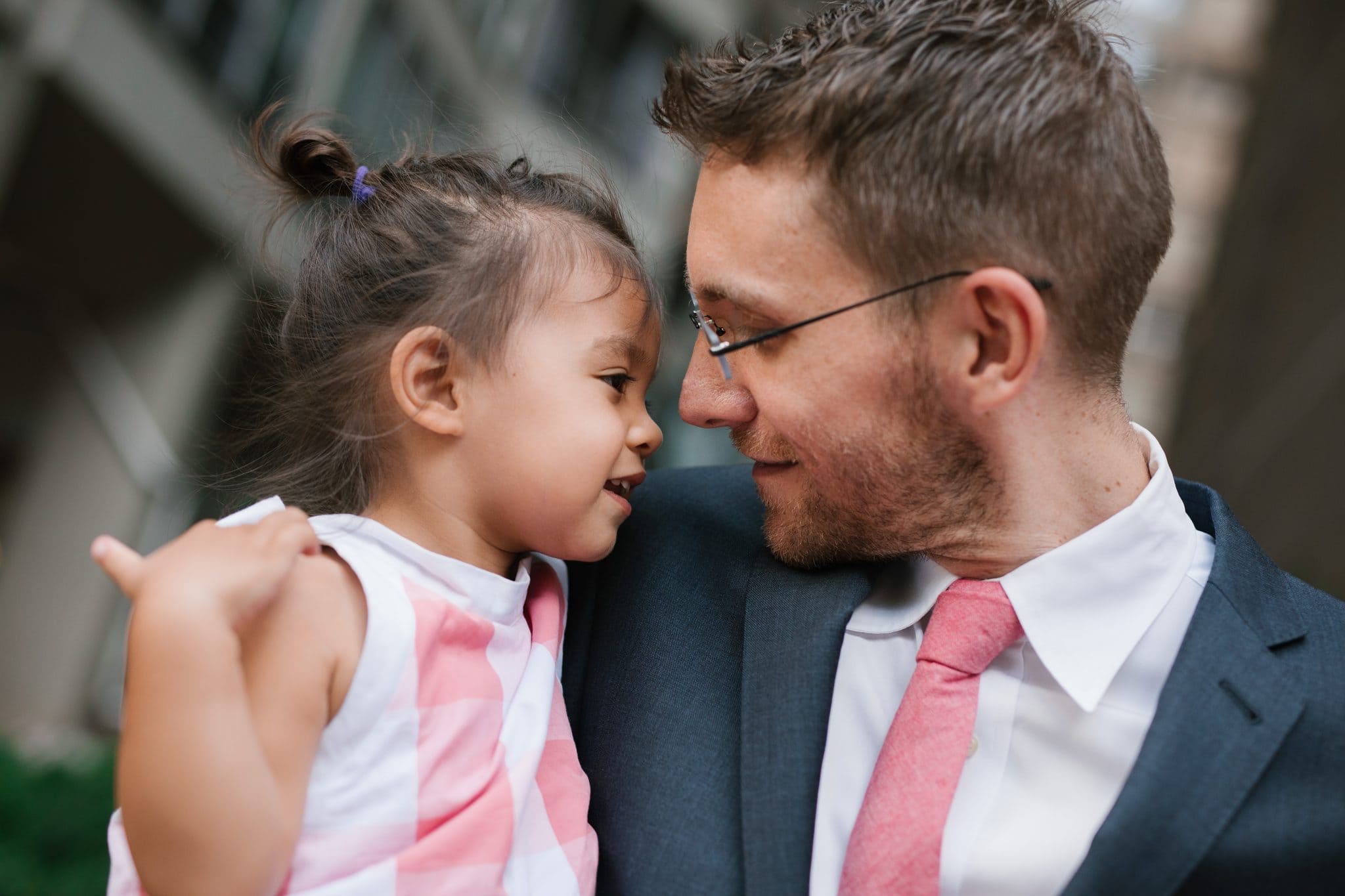 A father holding his daughter close during family reunion portraits at The Rittenhouse in Philadelphia