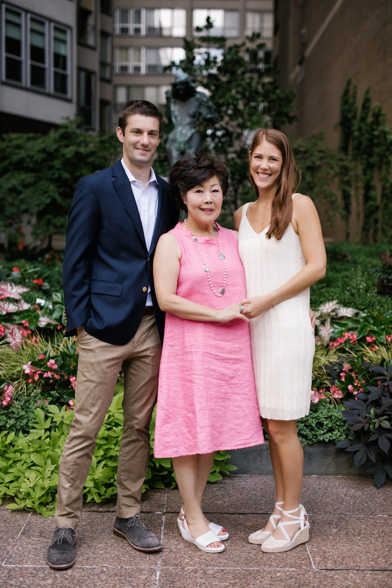 A three generation portrait in the courtyard greenery at The Rittenhouse in Philadelphia